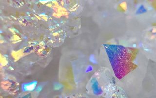 Meditating-with-Rainbow-Aura-Quartz-and-its-Healing-Properties