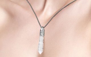 wearing clear quartz necklace